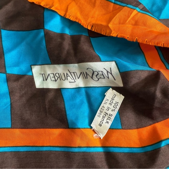 Yves Saint Laurent Silk Raw Hem
26” x 26”
Color Orange Blue Brown - Picture 4 of 4